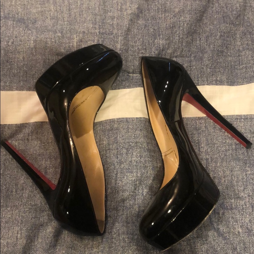 Christian louboutin black patent leather pumps.